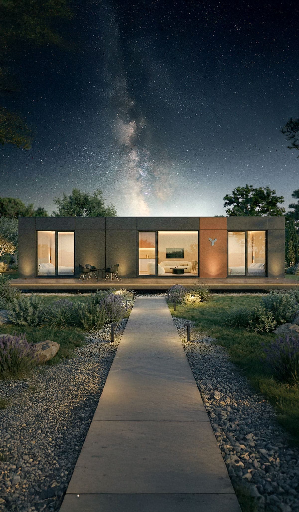 Modern POP UP modular home exterior at night with landscaped garden and warm interior lighting
