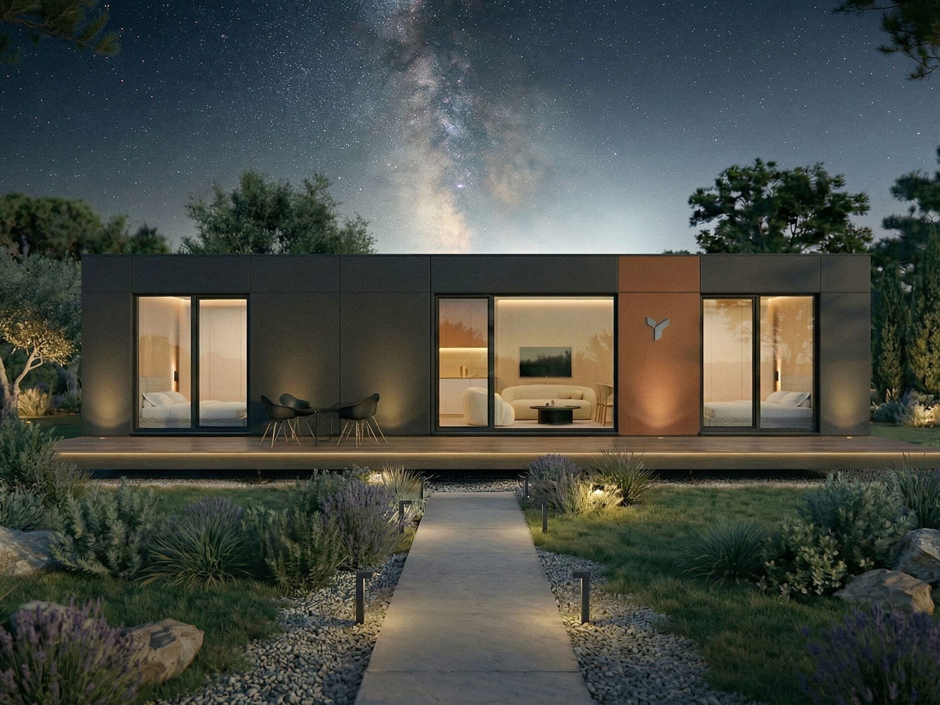 Modern POP UP modular home exterior at night with landscaped garden and warm interior lighting