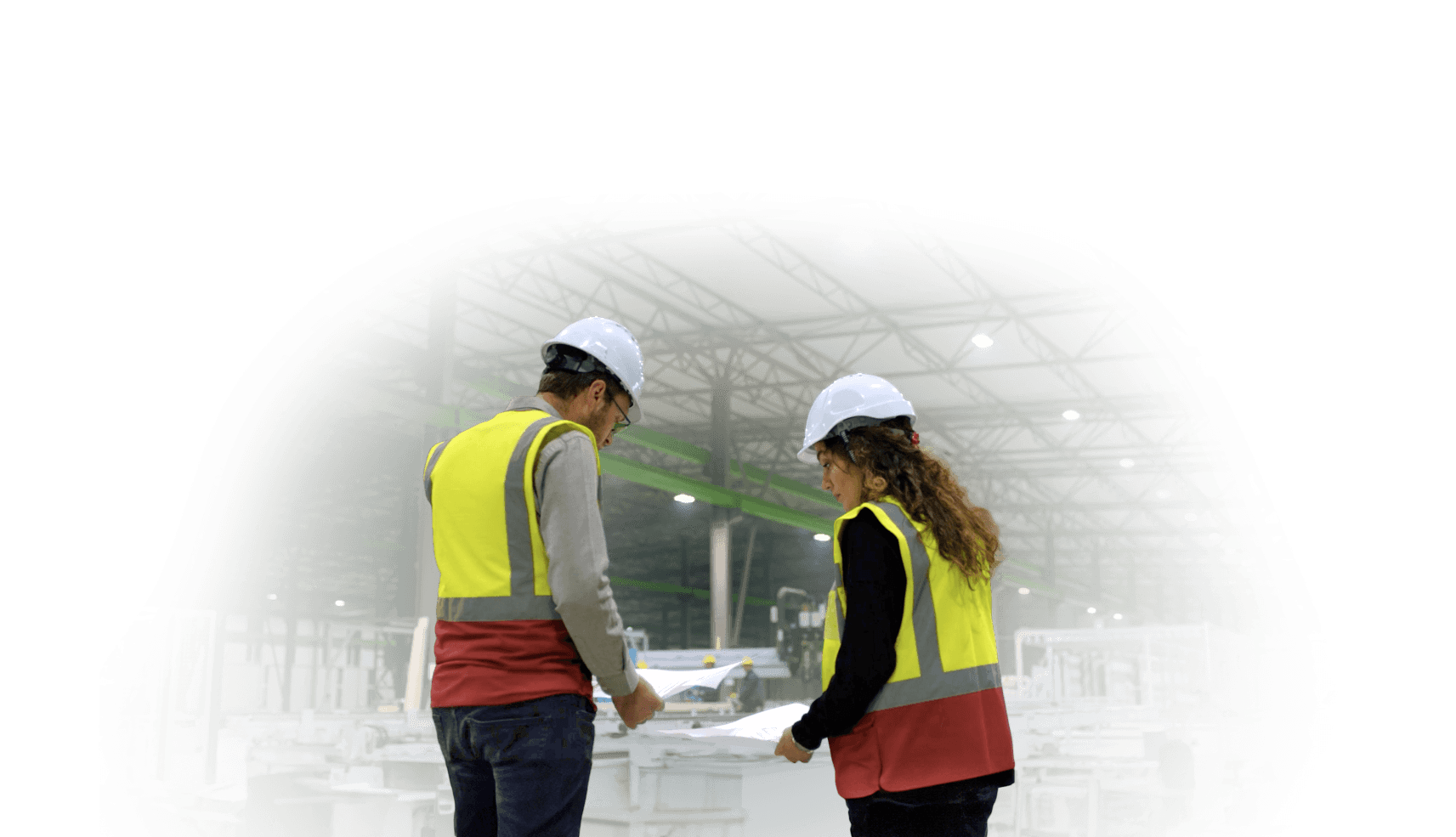 InstaBuilt team members reviewing construction plans inside the factory