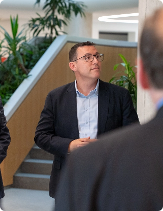 InstaBuilt leadership conversation in a modern office