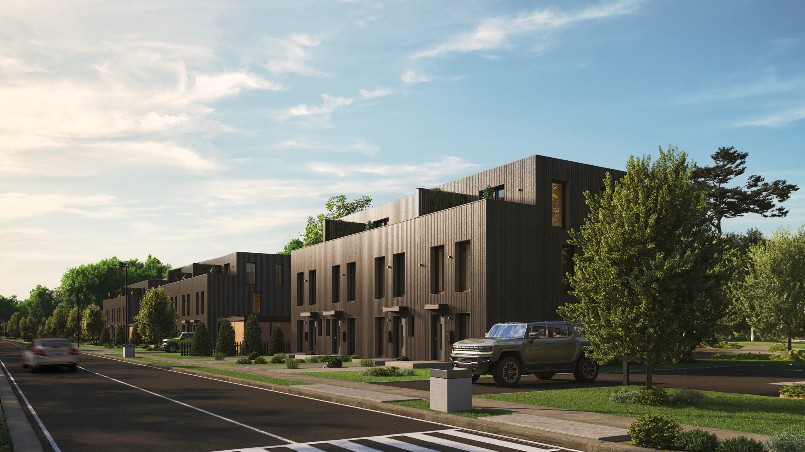 Modern three-story multifamily building on a tree-lined urban street